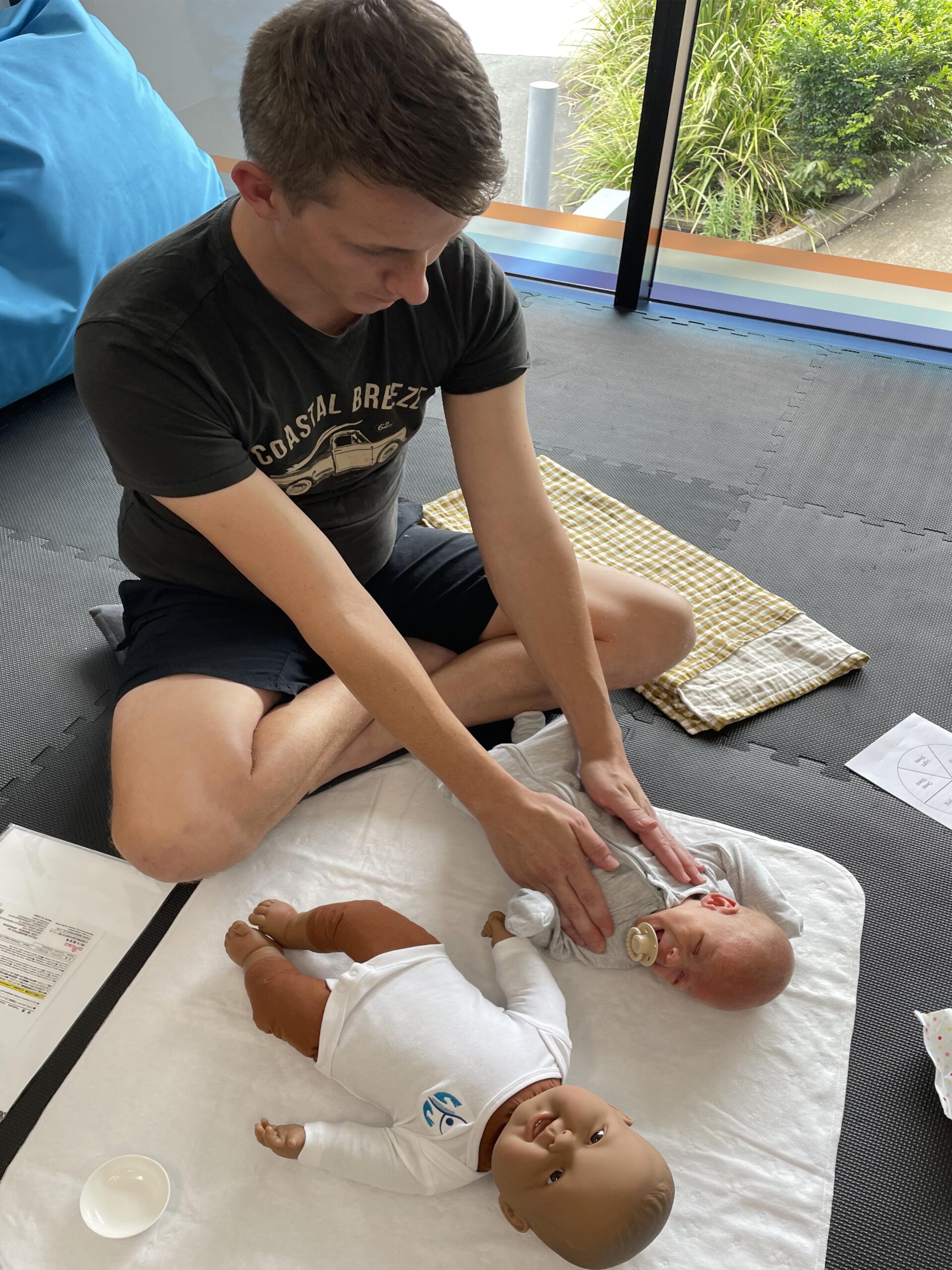 Dad and baby at baby massage class